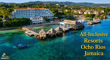 All-inclusive resorts in Ocho Rios Jamaica with a tropical beachfront hotel, turquoise waters, docks, and lush green hills.