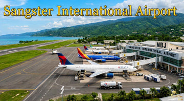 Aerial view of Sangster International Airport in Montego Bay, Jamaica, featuring passenger aircraft, runway, terminal, and coast.