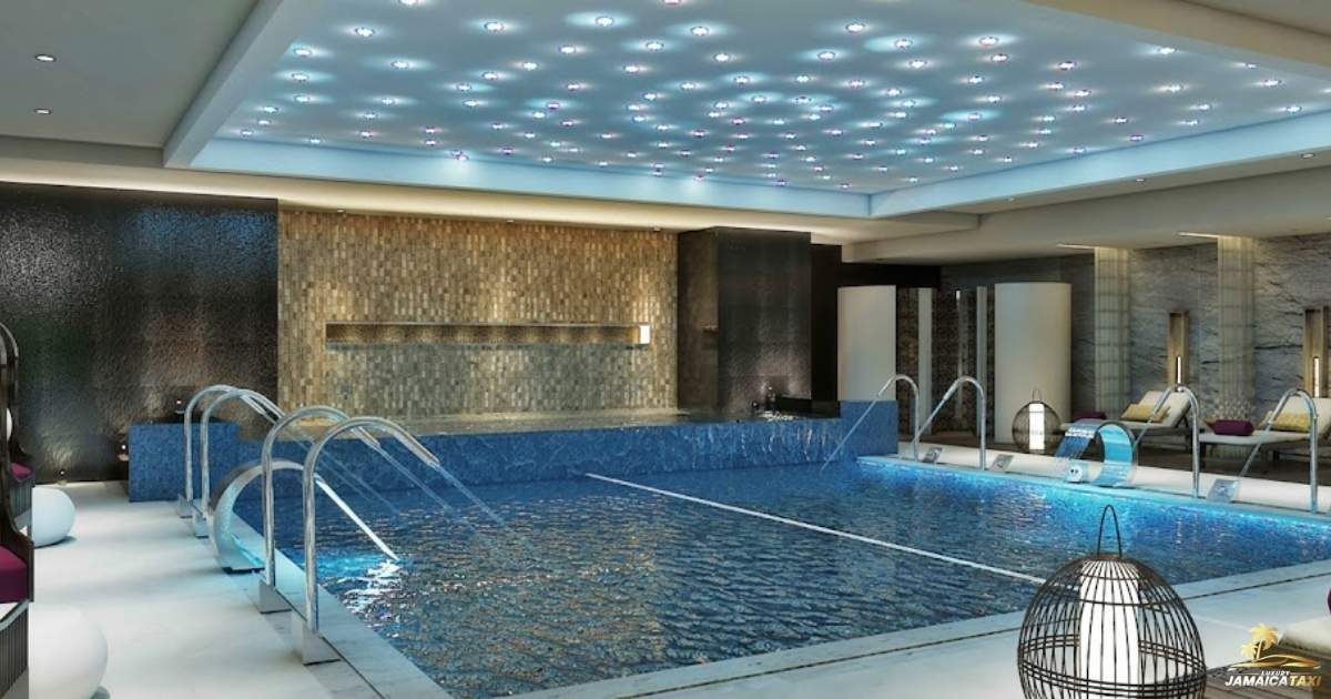 Indoor pool with modern decor and lighting fixtures.