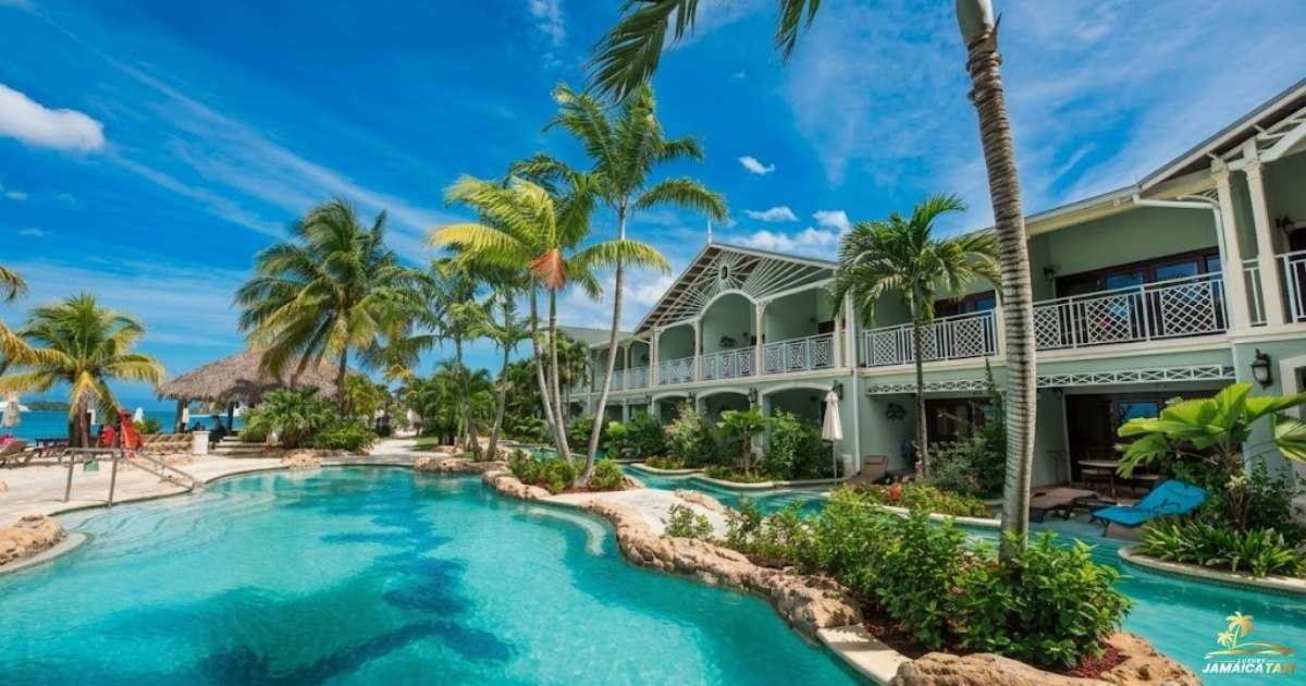 Luxury resort with pool and palm trees under a clear blue sky